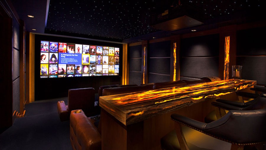 home theater with movie selection on the big screen and a Wisdom surround sound system