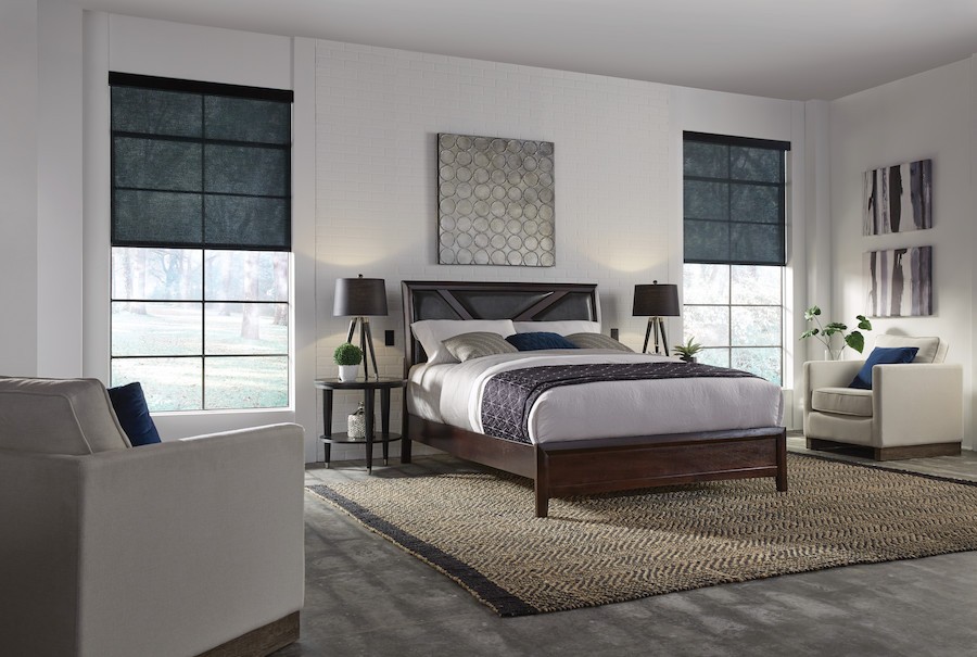 A bedroom with Lutron motorized shades.