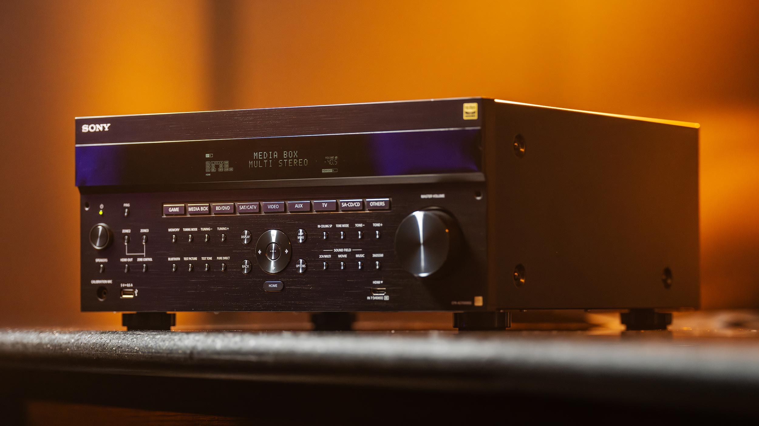 Audio receiver with detailed front panel and orange glow